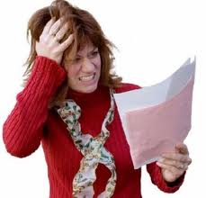 Stressed woman with papers